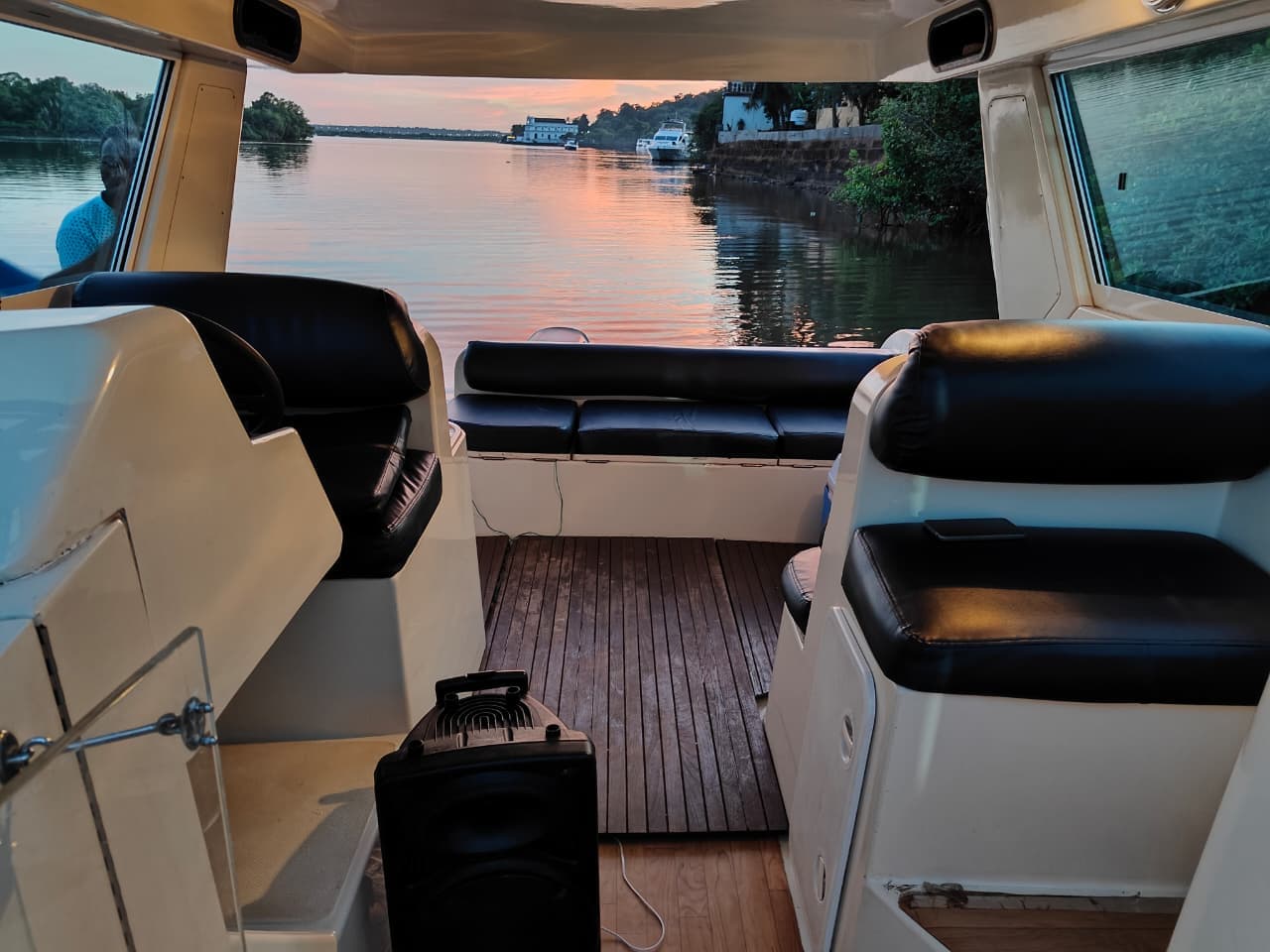 Sea Eagle yacht deck at golden hour on Mandovi River Goa